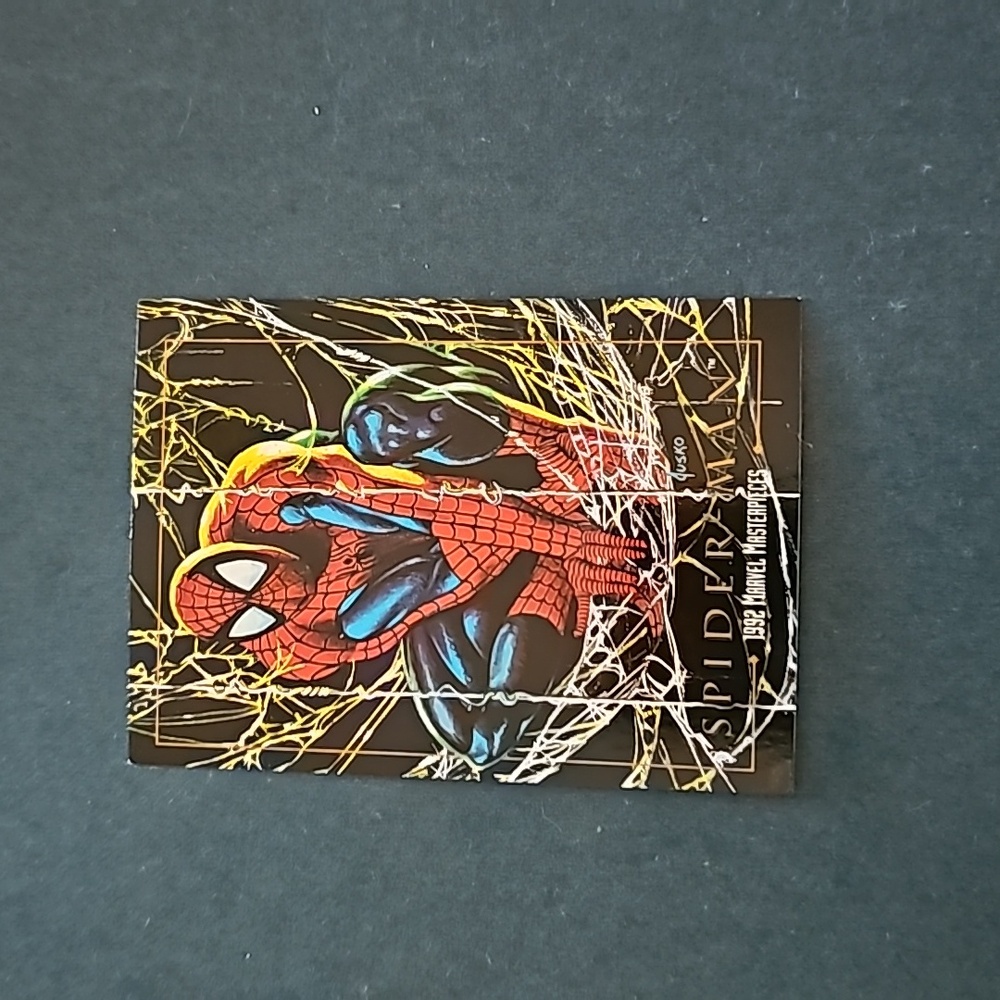 1992 Marvel masterpieces Spiderman error cut trading card.